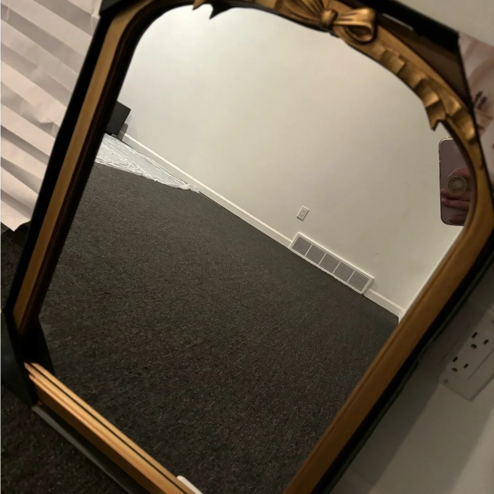 Gold bow mirror size is 18 x 24